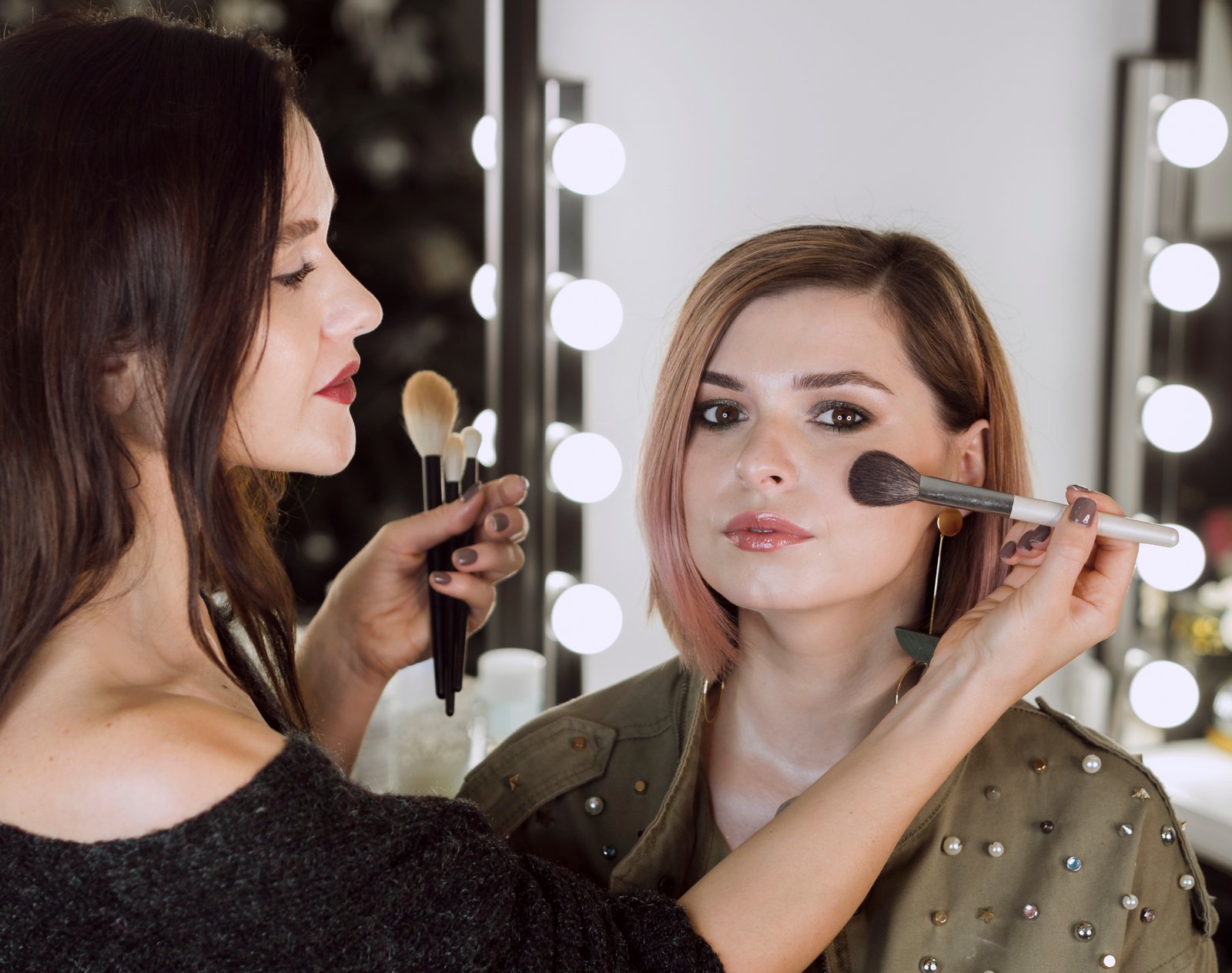 Makeup artist working on a client